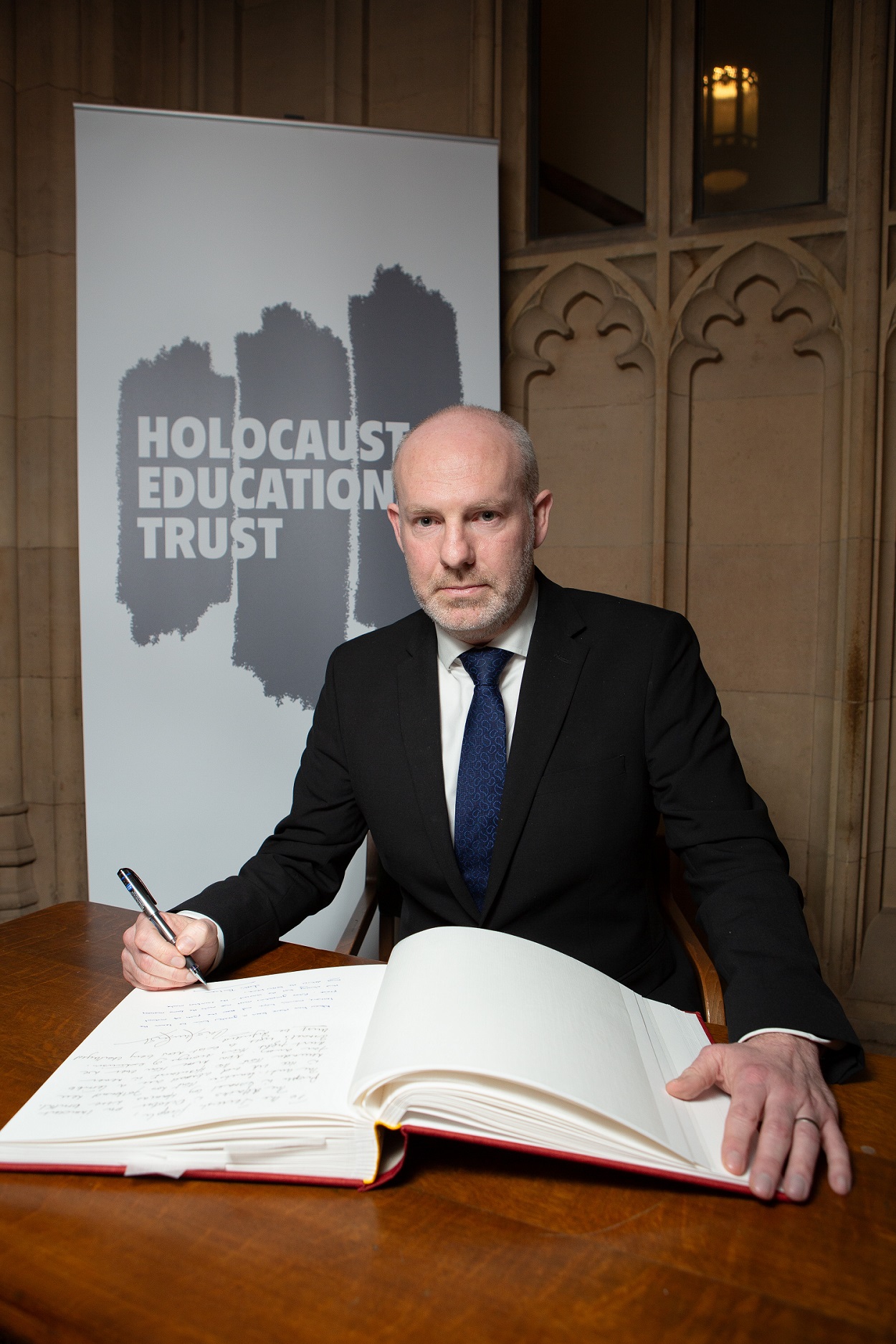 Justin Signs Holocaust Book Of Remembrance